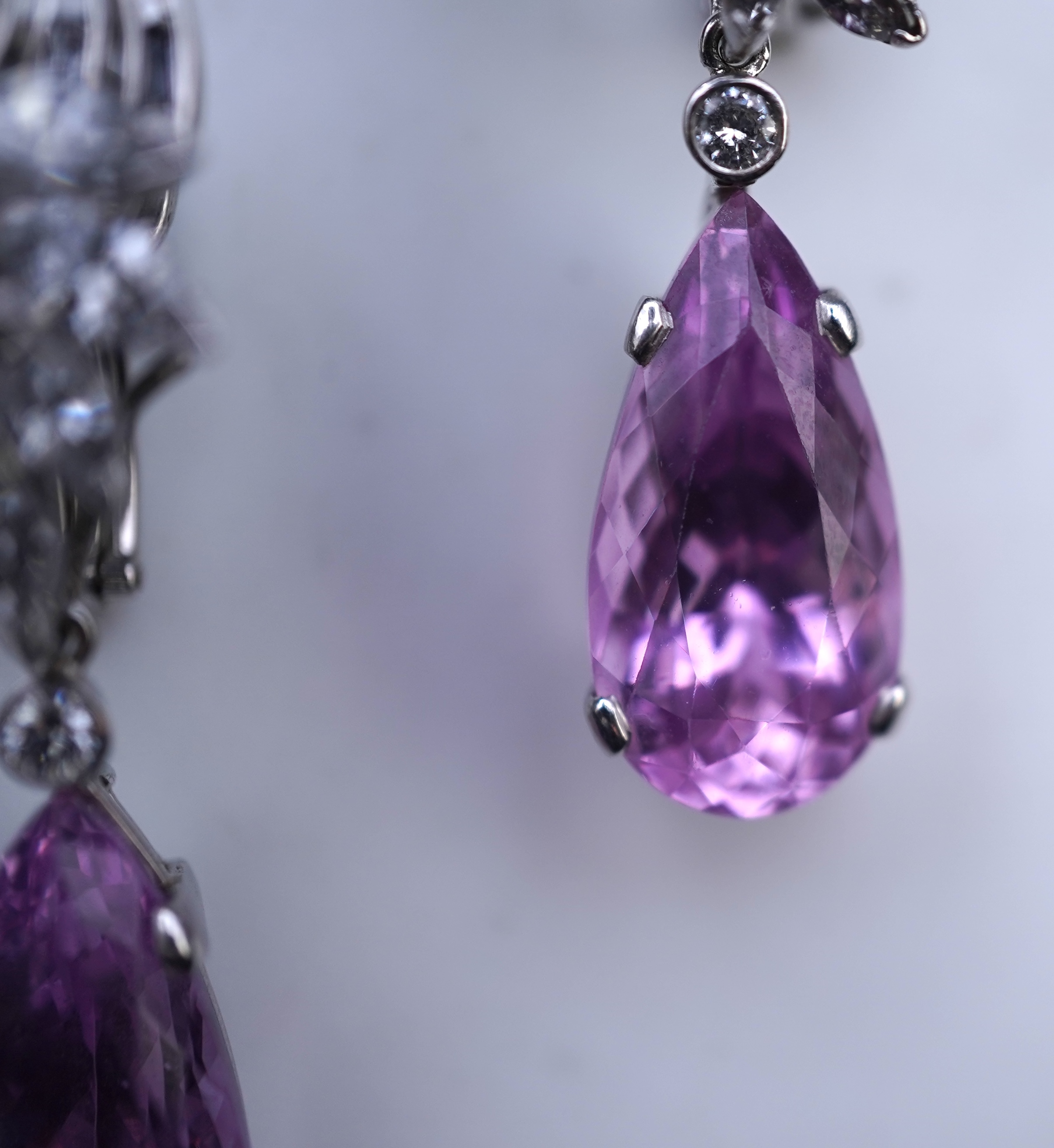 An attractive pair of 'day and night' kunzite and diamond ear clips